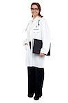 Full length shot of a physician holding medical file.