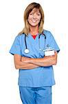 Experienced middle aged doctor with stethoscope around her neck posing arms crossed.