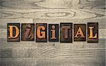 The word "DIGITAL" theme written in vintage, ink stained, wooden letterpress type on a wood grained background.