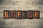 The word "REFUGE" theme written in vintage, ink stained, wooden letterpress type on a wood grained background.