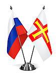 Russia and Guernsey - Miniature Flags Isolated on White Background.