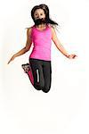Weight loss fitness woman jumping high, female model isolated on white background in full body