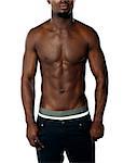 Cropped image of shirtless fit african guy isolated on white