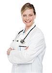 Female medical specialist posing with crossed arms isolated over white background