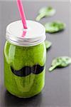 Jar of healthy and fresh green smoothie