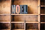 The word NOEL written in vintage wooden letterpress type in a wooden type drawer.