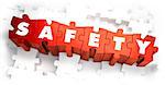 Safety - White Word on Red Puzzles on White Background. 3D Render.