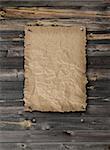 Empty Wild West wanted poster on weathered plank wood wall