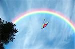 Air multicolored kite flying in the blue sky