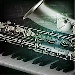 abstract green grunge vintage music background with piano and saxophone