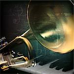 abstract grunge green vintage music background with trumpet and piano keys