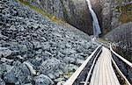 Wooden path leading to waterfall