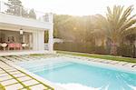 Luxury swimming pool surrounded by paver stones