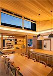 Illuminated wood ceiling over kitchen and dining table