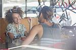 Couple talking at cafe table