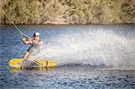 Mid adult man wakeboarding in sea, Cagliari, Sardinia, Italy