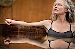 Mature woman sitting in hot tub at eco retreat