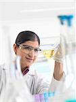 Female scientist developing chemical formula in laboratory