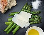 Fresh asparagus with hard cheese, overhead view