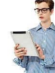 Stylish boy using touchpad device isolated over white