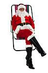 Isolated aged Santa relaxing with his legs crossed. Vacation time