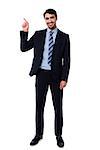 Handsome cheerful businessman pointing away