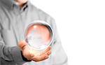 Caucasian man holding a glass or crystal ball, copy space on the left side of the image. Magician or fortuneteller background concept over white.