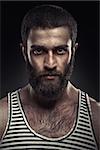 Portrait of a bearded man on dark background