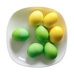 Easter eggs on a white plate. Isolated with clipping path. Top view.