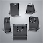 Set of the paper shopping bags isolated on gray background