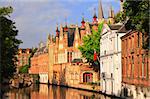 Historic medieval buildings along a canal in Bruges, Belgium