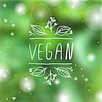 Hand-sketched typographic element. Vegan product label on blurred background. Suitable for ads, signboards, packaging and identity and web designs.