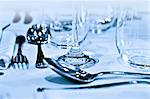 Close up view of table setting with cutlery and glasses