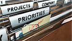 Close up on a file tab with the word Priorities with blur effect. Concept image for illustration of setting priorities in projects.