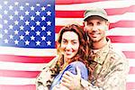 Soldier reunited with partner against rippled us flag