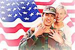 Army wife reunited with husband against rippled us flag