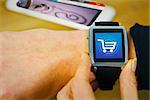 Businesswoman with smart watch on wrist against trolley