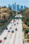 View of highway and city skyline, Los Angeles, California, USA