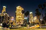 View of highway and city skyline at night, Los Angeles, California, USA