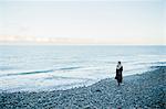 Woman strolling on beach