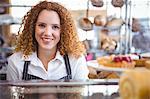 Happy pretty barista looking at camera