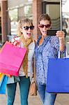 Beautiful women holding shopping bags making a selfie