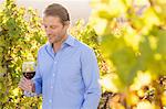 Smiling man with red wine glass