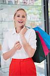 Pretty blonde with shopping bags