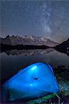 Camping with a tent under the Milky Way at Lac des Cheserys, looking at Mont Blanc, Haute Savoie, French Alps, France, Europe