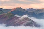 Catbells mountain surrounded by morning mist in autumn, Lake District National Park, Cumbria, England, United Kingdom, Europe