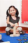 Girl playing with building blocks