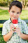 Boy drinking from juice carton, portrait