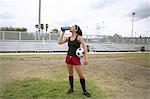 Soccer player drinking in field