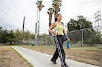 Soccer player leaving after practice in field